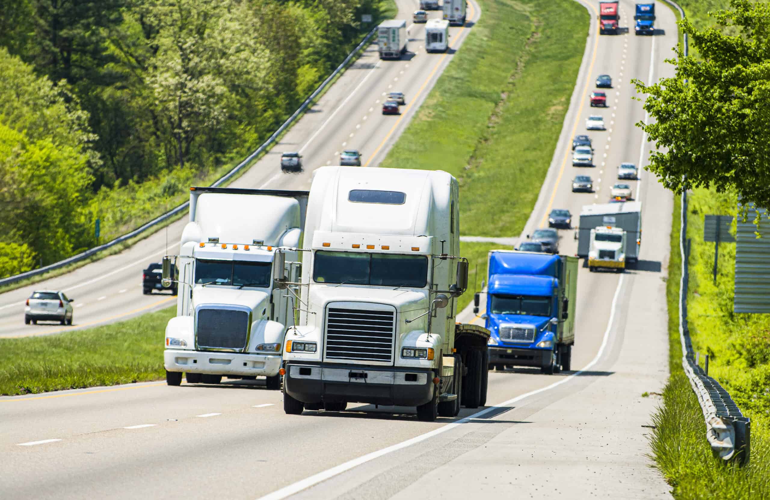 Semis travel on a busy Indiana highway